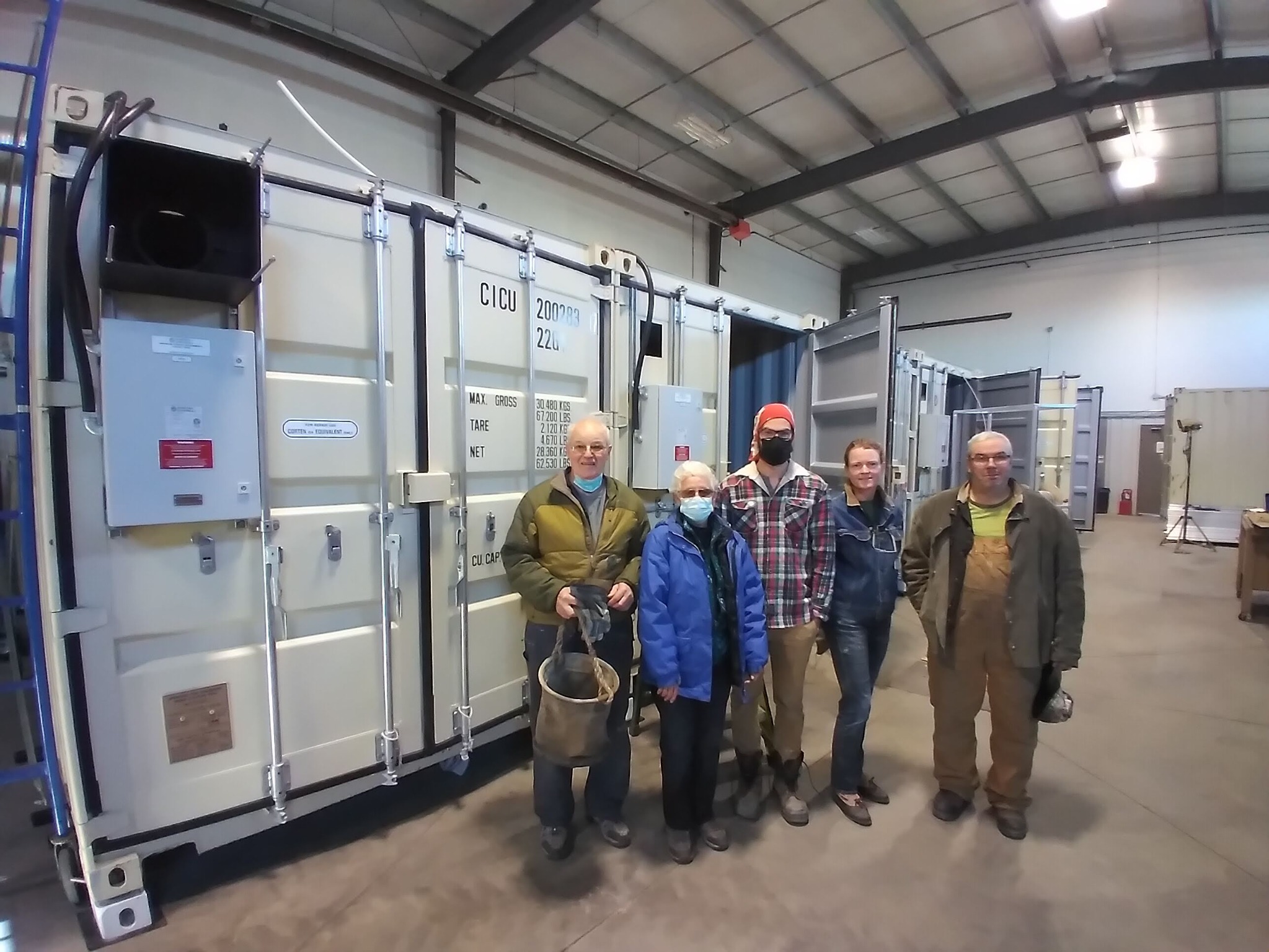 The Ceres team beside the container grow rooms in 2021